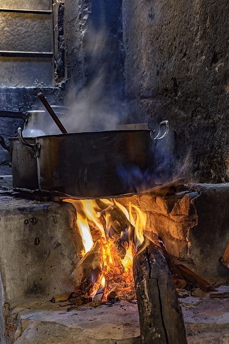 Traditional Brazilian food being prepared on old and popular wood stove, Brasil