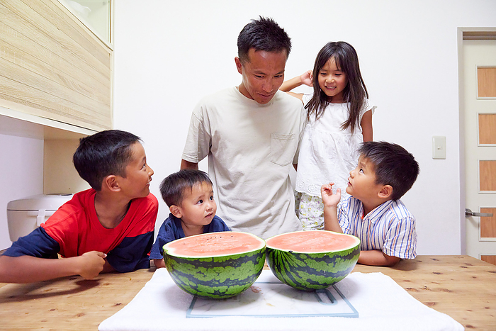 Japanese family eating watermelon