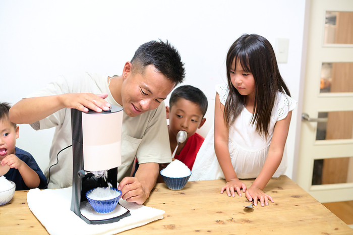 Japanese family making shaved ice