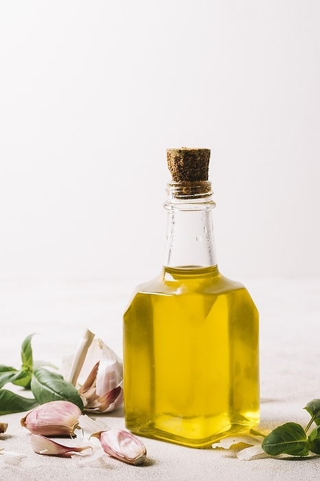 Vertical shot olive oil bottle with golden color