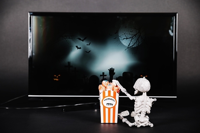 Small skeleton with popcorn tv
