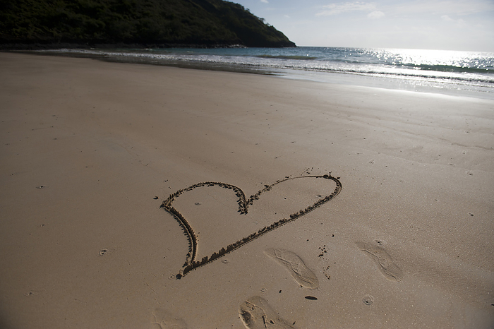 Heart is drawn in the beach sand on Floreana Island in Galapagos Islands National Park; Floreana Island, Galapagos Islands, Ecuador, by Joel Sartore Photography / Design Pics