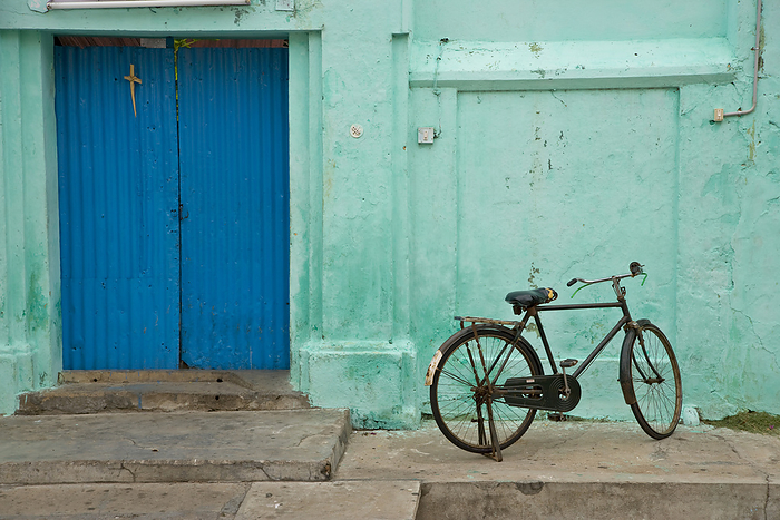 Bicycle parked outside a home in Pondicherry, the French area of South India; Pondicherry, India, by Michael Melford / Design Pics