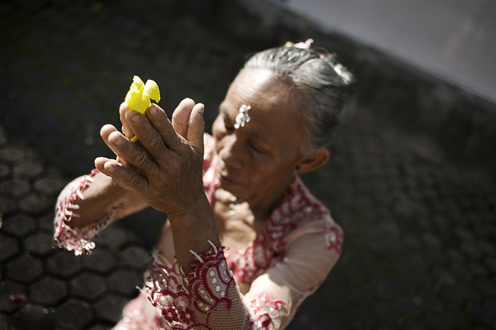 Indonesia Woman Praying During Kuningan Festival  Bali, Indonesia, by Huy Lam   Design Pics