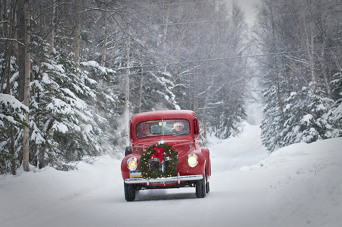 Man Driving A Vintage 1941 Ford Pickup With A Christmas Wreath On The Front During Winter In Southcentral, Alaska, by Jim Lavrakas / Design Pics