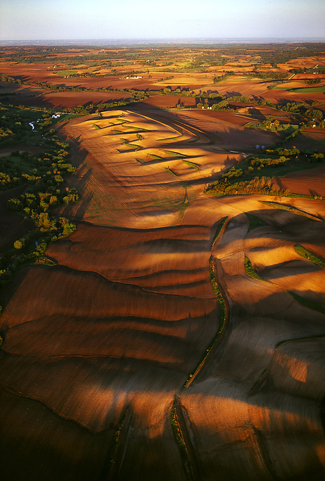 America Agriculture   Aerial view of rolling fallow agricultural land in late afternoon light   near Woodbine, Iowa, USA., by Jim Wark   Design Pics