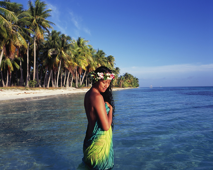 Tahitian Woman Bathing By The Waters Edge; Tahiti, by David Kirkland / Design Pics