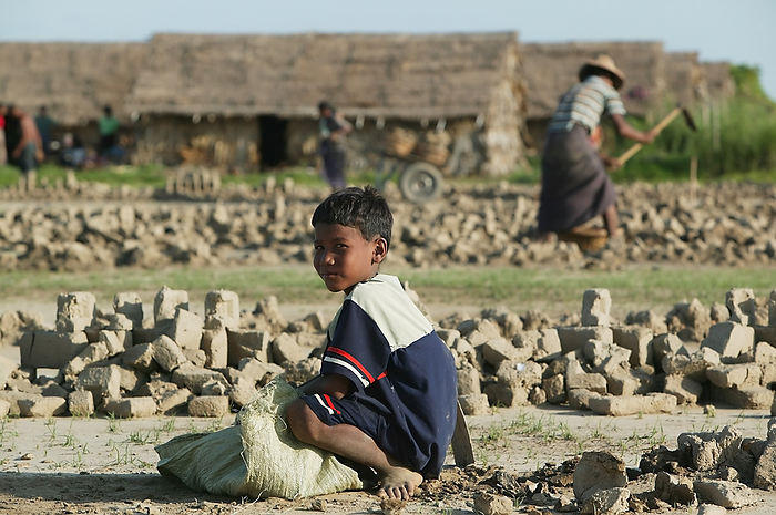 Myanmar Boy Working To Make Bricks From Clay In Myanmar  Ayeyarwady, Burma, by Jim Holmes   Design Pics