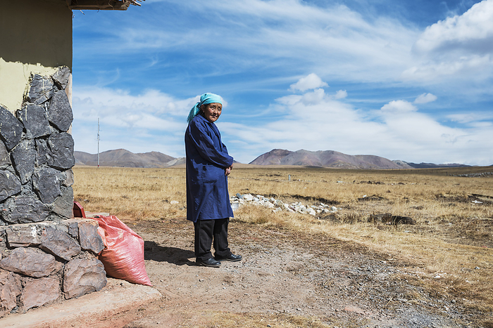 Tibet Kind Tibetan Woman Near Her House At Qilian Region  Tibet, by Sergey Orlov   Design Pics