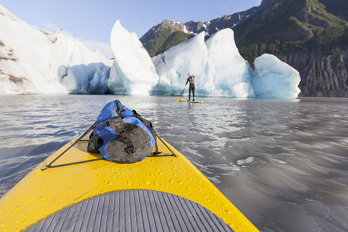 Pov From A Stand Up Paddleboarder Of Grewingk Glacier And Fellow Paddleboarder, Kachemak Bay State Park, Southcentral Alaska, by Scott Dickerson / Design Pics