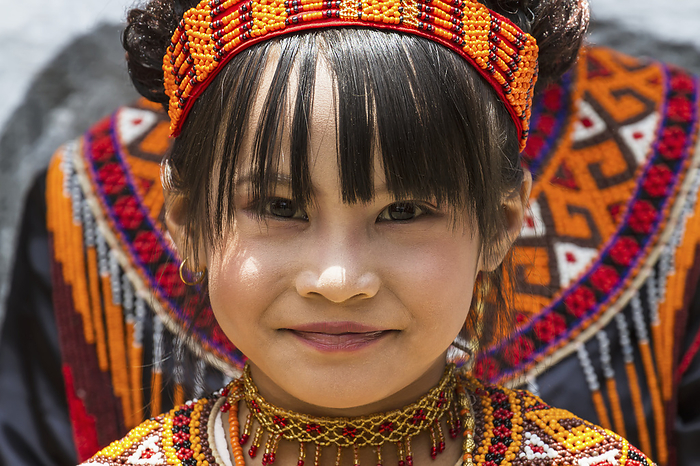 Indonesia Girl In Traditional Torajan Dress Attending A Funeral Ceremony At A Rante, The Ceremonial Site For A Torajan Funeral, In Sereale, Toraja Land, South Sulawesi, Indonesia, by Peter Langer   Design Pics