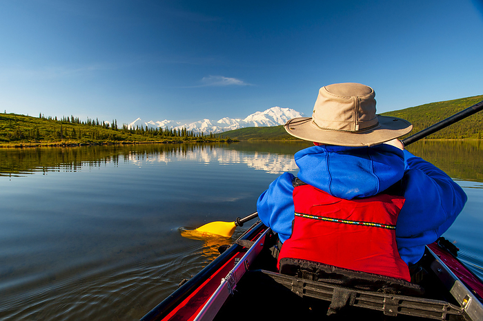 Man Kayaking On Wonder Lake With Denali In The Background, Interior Alaska, Summer, by Michael Jones / Design Pics
