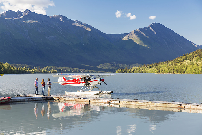 America Visitors Wait For The Pilot To Dock While, Trail Lake Float Plane Base, Moose Pass, Kenai Peninsula, Southcentral Alaska, USA, by Kevin G. Smith   Design Pics
