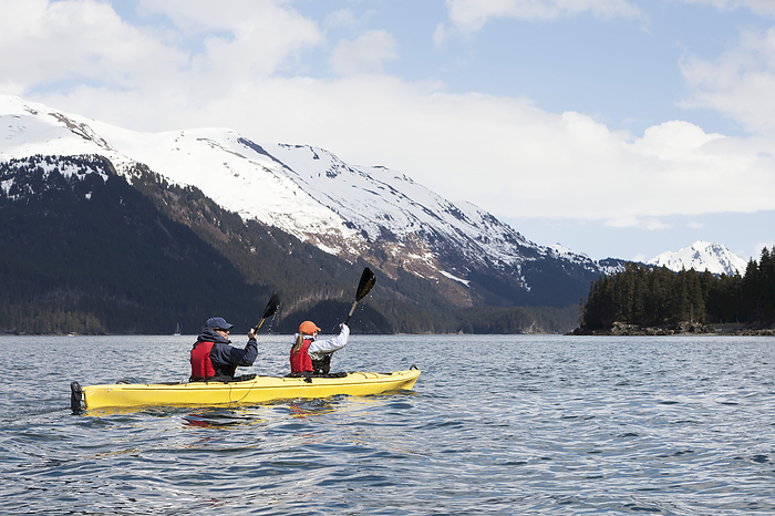 America Two sea kayakers in a double sea kayak, Kachemak Bay, Southcentral Alaska  Alaska, United States of America, by Scott Dickerson   Design Pics