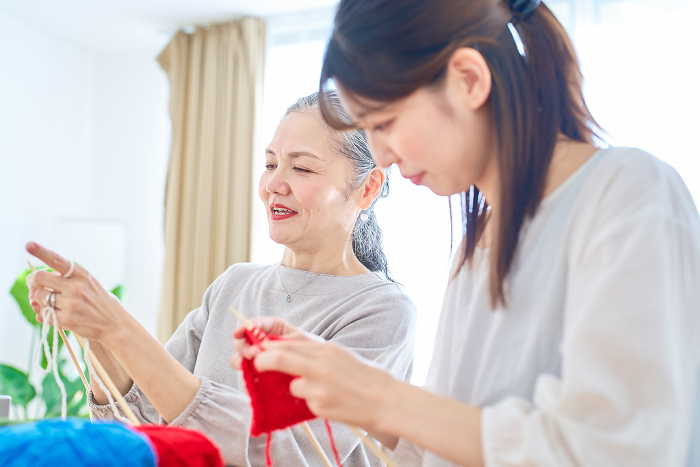 Senior woman and young Japanese woman knitting (People)