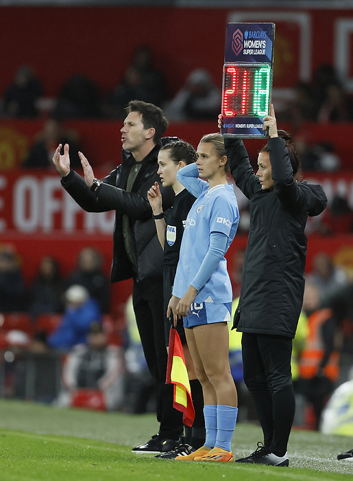 Manchester United v Manchester City   Barclays Women s Super League Gareth Taylor, Manager of Manchester City brings on Kerstin Casparij of Manchester City next to assistant referee Ceri Williams between while Fourth Official Rebecca Welch holds number board during the Barclays Women s Super League match between Manchester United and Manchester City at Old Trafford on November 19, 2023 in Manchester, England.  This Photograph May Only Be Used For Newspaper And Or Magazine Editorial Purposes. May Not Be Used For Publications Involving 1 Player, 1 Club Or 1 Competition Without Written Authorisation From Football DataCo Ltd. For Any Queries, Please Contact Football DataCo Ltd on  44  0  207 864 9121