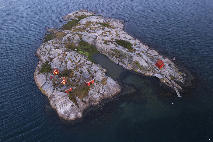 Red traditional boat houses and cottages on a rocky island surrounded by the ocean, Bohuslan, West Sweden, Scandinavia, Europe Red traditional boat houses and cottages on a rocky island surrounded by the ocean, Bohuslan, West Sweden, Scandinavia, Europe, by Paolo Graziosi