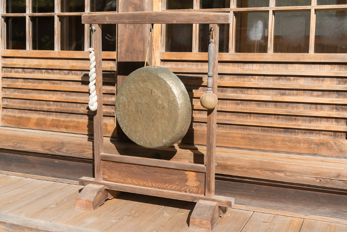 Gongs hung on a wooden frame stand