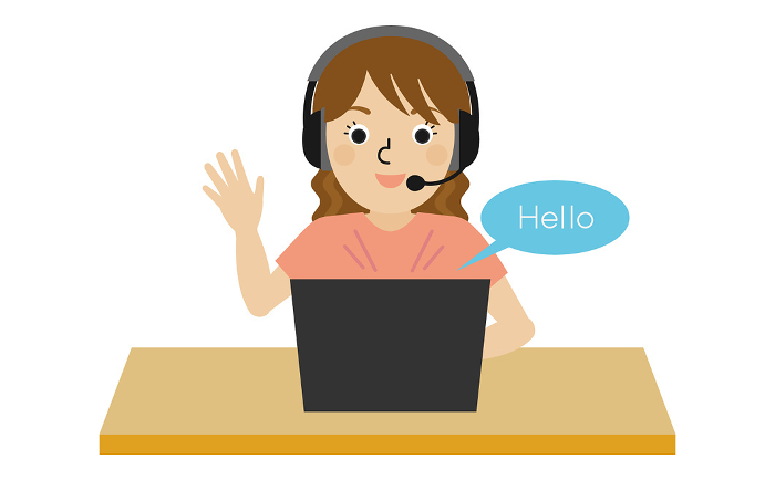 Front view of a Japanese woman wearing headphones and speaking English online.