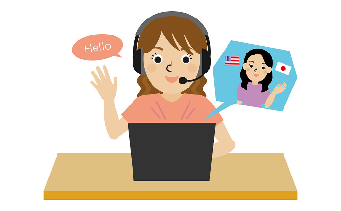 Front view of a Japanese woman wearing headphones and speaking English online with a bilingual Japanese-English teacher.