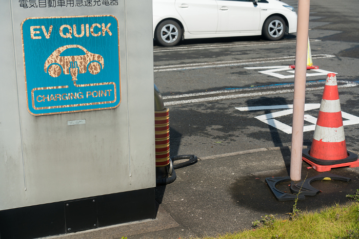 Discolored signage for EV chargers and unused EV charging parking lot