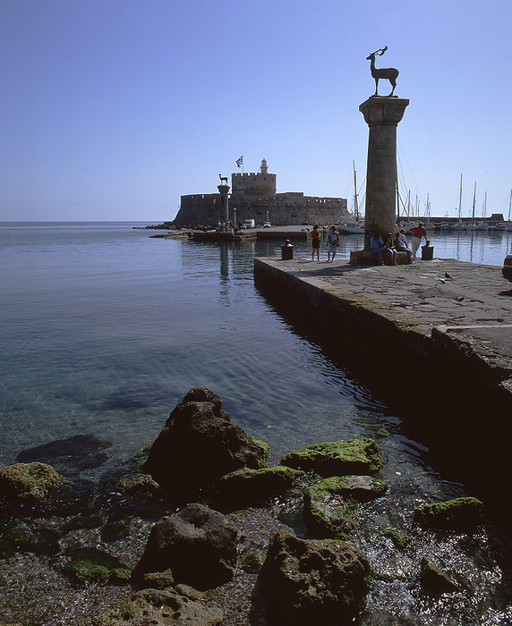 Mandraki Harbour, Rhodes, Greece, 2019. Creator: Ethel Davies. St Nicholaos Castle and the famous deer statue straddle the entrance to Mandraki Harbour in Rhodes, the largest island in the Dodecanese and the location of the Knights of St John during the Crusades, Greece, 2019. Creator: Ethel Davies.