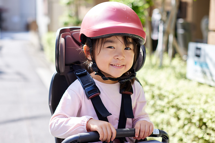 Japanese girl riding a bicycle