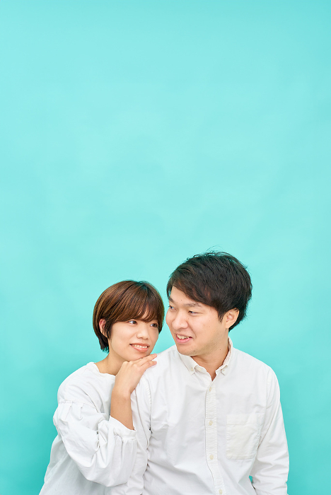 Japanese man and woman in intimate setting.