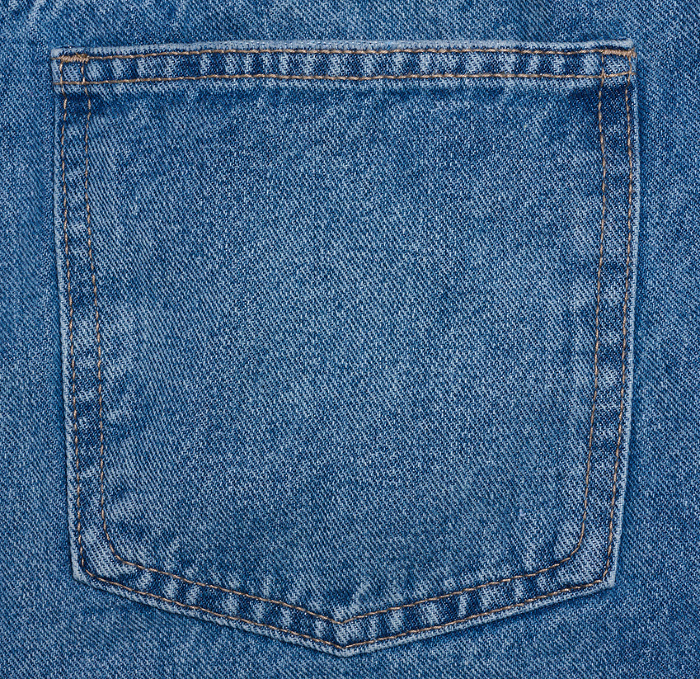 Back pocket of blue jeans, close up Back pocket of blue jeans, close up