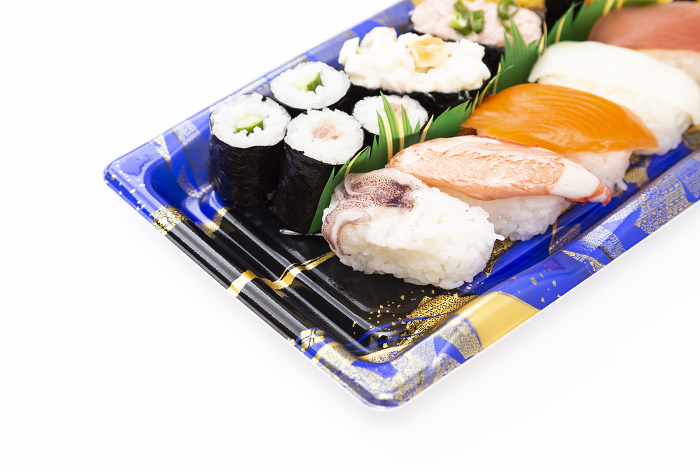 Packed sushi placed on white background