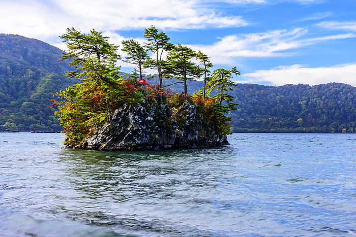Ebisu-Daikokujima Island in autumn leaves from the shore of Lake Towada, Aomori