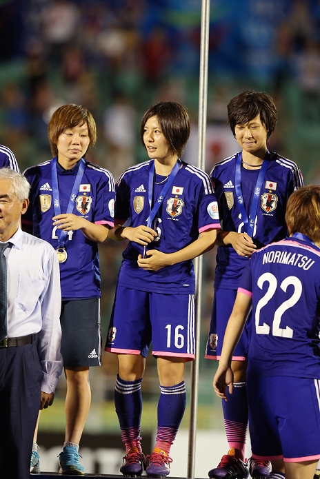 2014 AFC Women s Asian Cup Nadeshiko Japan wins first place  L R  Ami Sugita, Hikaru Naomoto, Shiho Kohata  JPN , MAY 25, 2014   Football   Soccer : Ami Sugita, Hikaru Naomoto and Shiho Kohata of Japan celebrate their winning on the podium after the 2014 AFC Women s Asian Cup final match between Japan 1 0 Australia at Thong Nhat Stadium in Ho Chi Minh City, Vietnam.  Photo by Takahisa Hirano AFLO 