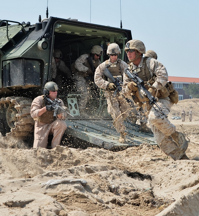 U.S. South Korea Joint Military Exercise Landing Exercise  Ssangyong  Unveiled April 1, 2014, Pohang, South Korea : U.S. Marines soldier run from Assault Amphibious Vehicle  AAV7  at Dogu Beach in Pohang, South Korea, on April 1, 2014.  Photo by AFLO 