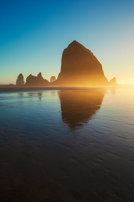 United States of America Afternoon Light on Haystack Rock at Cannon Beach   Oregon, Evening light illuminating Haystack Rock, Cannon Beach at sunset, Oregon, USA