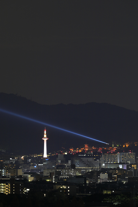 Kiyomizu Temple and Kyoto Tower illuminated by lights Kyoto Pref. The blue light emanating from Kiyomizu Temple represents the  mercy of the Goddess of Mercy .
