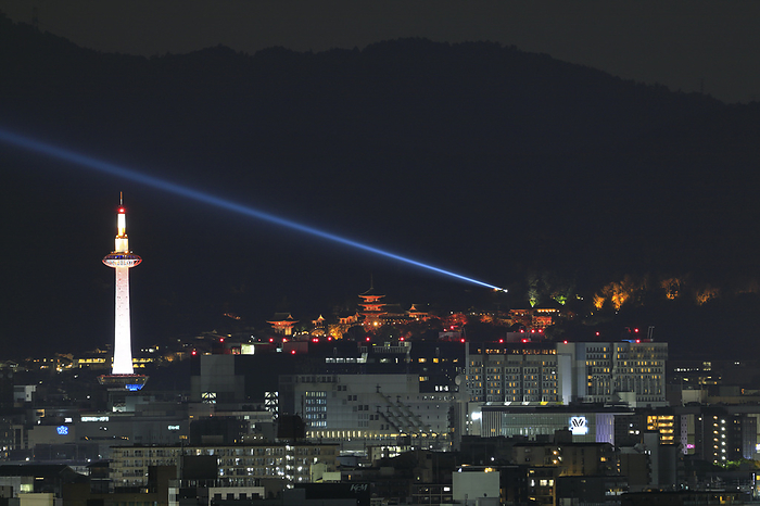 Kiyomizu Temple and Kyoto Tower illuminated by lights Kyoto Pref. The blue light emanating from Kiyomizu Temple represents the  mercy of the Goddess of Mercy .