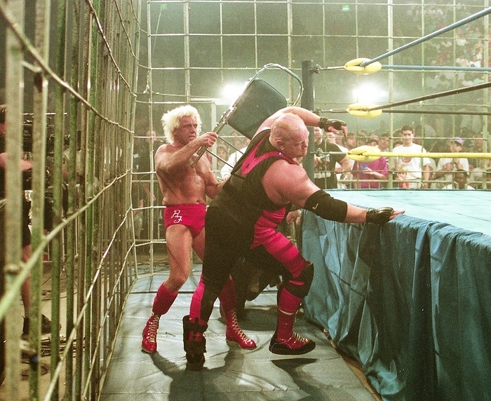 1994 WCW Flair vs. Bader 19940220, WCW, Ric Flair  left  hits Big Bang Vader with a chair, Thunder Cage Match, Albany Civic Center, Georgia, USA