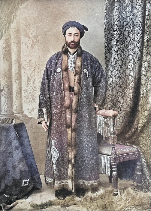 Officer in charge of the Holy Shrine at Meshhed Coloured photograph of officer in charge of the Holy Shrine at Meshhed  Mashhad . From  The living races of mankind: a popular illustrated account of the customs, habits, pursuits, feasts and ceremonies of the races of mankind throughout the world, Volume 1  by Sir Harry Hamilton Johnston, Henry Neville Hutchinson, Richard Lydekker and Dr A H Keane  1902 ., by PHOTOSTOCK ISRAEL SCIENCE PHOTO LIBRARY