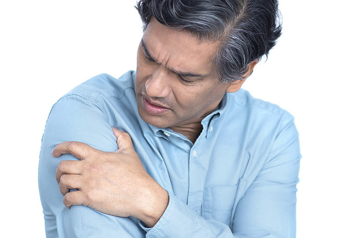 Man with arm pain Man with arm pain., by SCIENCE PHOTO LIBRARY