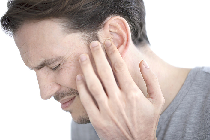 Man with earache Man with earache., by SCIENCE PHOTO LIBRARY