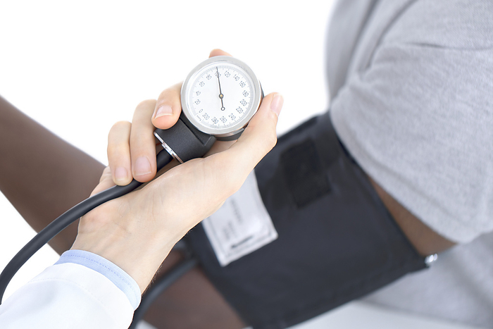 Checking blood pressure Checking blood pressure., by SCIENCE PHOTO LIBRARY