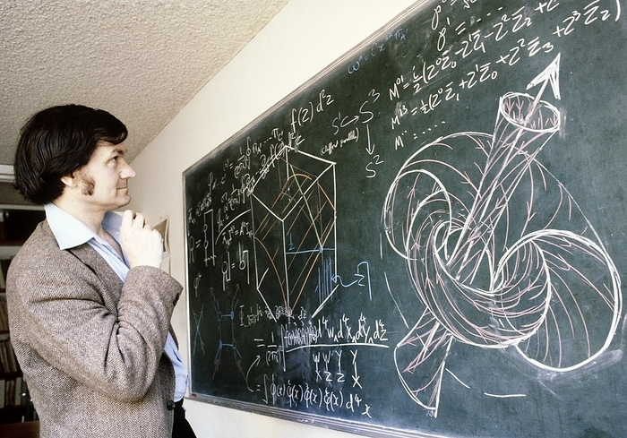 Professor Roger Penrose Professor Roger Penrose  born 1931 , theoretical mathematician at Oxford University and inventor of twistor theory. Photographed at blackboard with diagram of a twistor, Oxford, 1980., by ANTHONY HOWARTH SCIENCE PHOTO LIBRARY