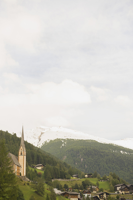 Church,  Heiligenblut , Heiligenblut, Austria St Vincent church with mountain in the background, Heiligenblut,  Carinthia, Austria, by Cavan Images   Edith Drentwett