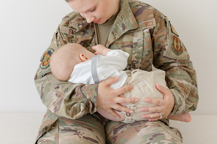 active duty air force airman breastfeeds her baby while in uniform active duty air force airman breastfeeds her baby while in uniform, by Cavan Images   Virginia Schultz