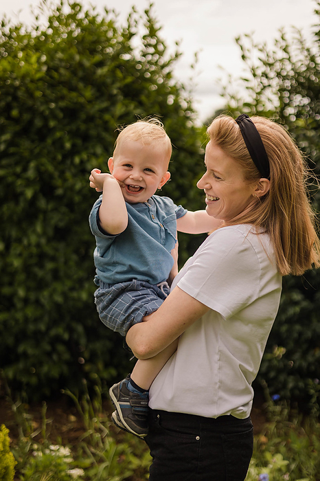 Sarah McKernan Stock Portfolio Mother and toddler share joyful playtime in the garden, by Cavan Images   Sarah McKernan