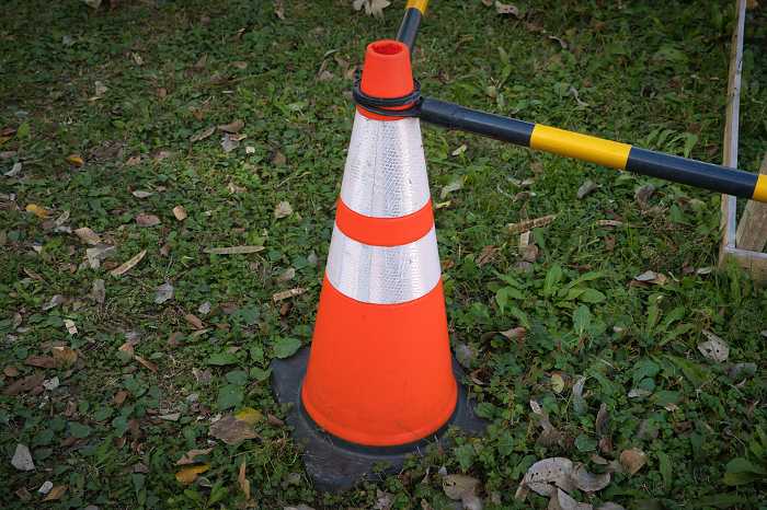 Construction triangular cones promoting cautionary regulations