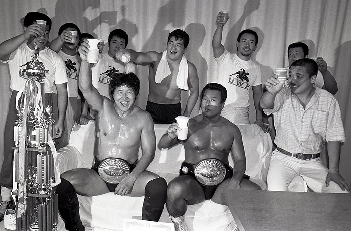 1986 New Japan Pro Wrestling: Osamu Maeda and Osamu Kido win IWGP Tag Team titles 19860805, New Japan Pro Wrestling, New Japan Pro Wrestling, The team of Nichiaki Maeda and Osamu Kido are congratulated in the waiting room after winning the IWGP Tag Team titles  back row, from right, Yoshiaki Fujiwara, Nario Miyado  Yuko Miyado , Kazuo Yamazaki, Nobuhiko Takada  Nobuhiko Takada , Yoji Yasuo, and others  Ryogoku Kokugikan, Tokyo.