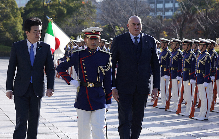 Italian Defense Minister Visits Japan, Visits Defense Ministry Italian Defense Minister Crosset  center right  receives a ceremonial salute of honor. On the left is Defense Minister Minoru Kihara at the Ministry of Defense at 8:58 a.m. on December 14, 2023, photo by Yuki Miyatake.