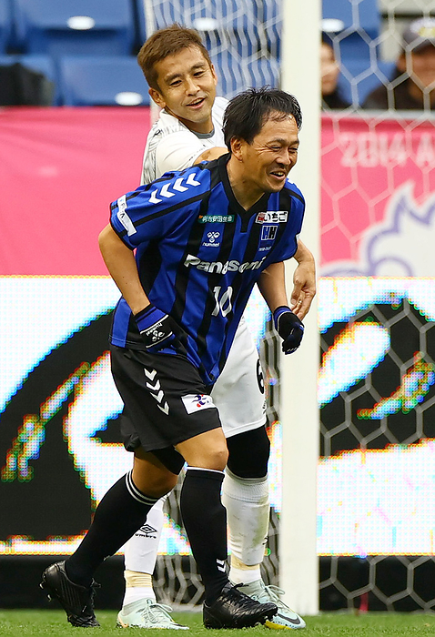 Hideo Hashimoto Retirement match Hideo Hashimoto Retirement Match  G Osaka 05 vs. Japan National Team Friends Takahiro Futagawa, G Osaka 05, enjoys playing in the first half. In the back is Junichi Inamoto of Japan s national team, Junichi Inamoto of Japan s national team, at Panasonic Stadium Suita on December 16, 2023.