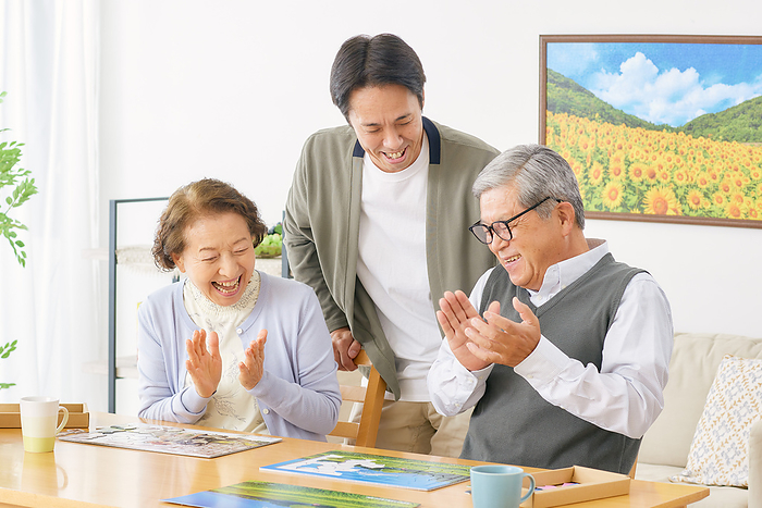 Japanese family doing a puzzle in the living room